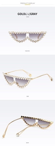 Vue en trois angles des lunettes œil de chat dorées avec strass et verres dégradés gris
