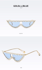 Gros plan de lunettes de soleil œil-de-chat dorées avec verres bleus et strass brillants