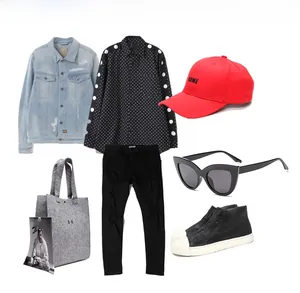 Fashion ensemble featuring cat-eye sunglasses and denim jacket in a flat lay style