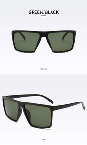 Detail view of large square polarized sunglasses with matte black frames and green lenses