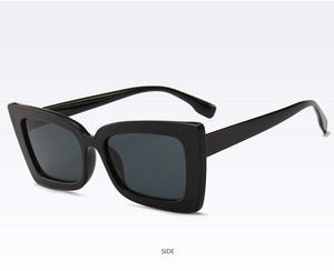 Detail view of the durable black square frame sunglasses with thick temple design