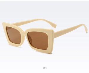 Side view detail of fashion oversized square sunglasses with cream frame and brown lenses