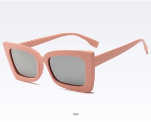 Side view of trendy rectangular pink sunglasses with wide frame and grey lenses
