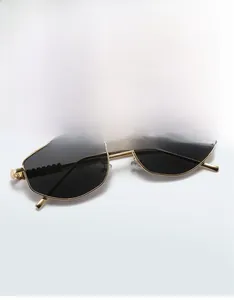 Detailed close-up of retro irregular metal sunglasses with unique jagged temple designs