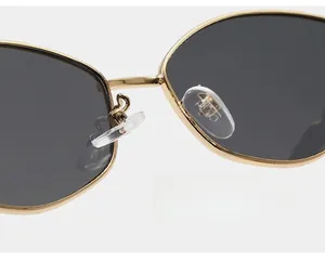 Detail of eco-friendly silicone nose pads on gold metal frames for enhanced comfort