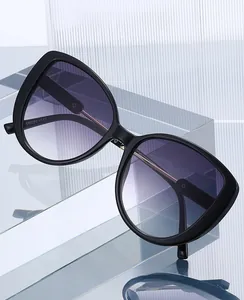 Detail showing inner temple size 56-20-145 on black oversized cat-eye sunglasses