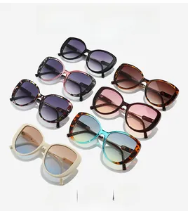 Flat lay of stylish oversized square sunglasses in black, leopard, and beige colors