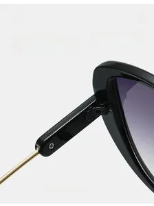 Detail showing the durable metal hinge and sleek black temple of the square sunglasses