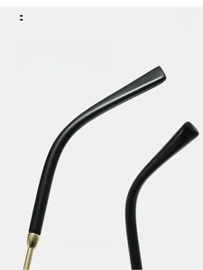 Detail of lightweight metal sunglasses temples with curved black resin tips for comfort