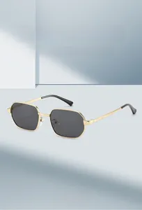 Detailed close-up of geometric polygon metal frame sunglasses with dark gray lenses