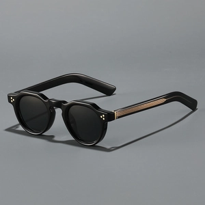 Vintage round thick frame sunglasses with metallic textured temples in a 45-degree view