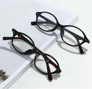 Detail of tortoise and black oval glasses frames with silicone nose pads on magazine