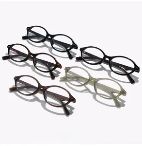 Detailed flat lay of oval frame glasses in tortoise, black, and olive green colors