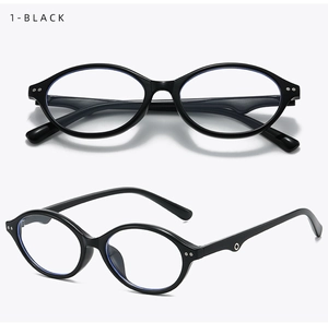 Detail of black oval glasses frame with blue light blocking lenses and side metal accents