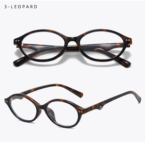 Detail of tortoise shell oval glasses with silver rivets and soft silicone nose pads