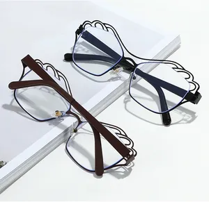 Detail of irregular hollow wave metal frame eyewear in black and brown finish
