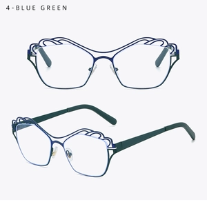 Detail of blue-green irregular metal glasses frames with hollow wave cloud design