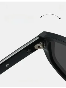 Detail of durable silver metal hinge and sturdy black frame on stylish cat eye sunglasses