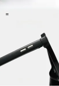Detail of high-gloss resin hinge with silver metal inlay on black square sunglasses