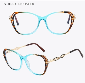 Macro detail of blue leopard cat-eye frames with golden twisted metal temples
