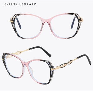Macro detail of pink leopard cat-eye frame and golden twisted hollow metal temples