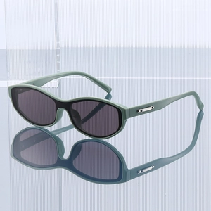 Retro light green cat eye sunglasses with dark lenses and silver metal hinges