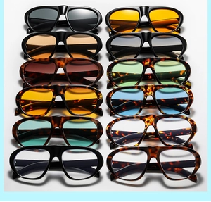 Collection of retro sunglasses in black and tortoiseshell frames with multi-color lenses