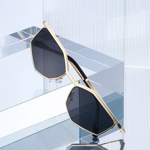 Metallic polygonal cat-eye sunglasses with geometric frames and dark tinted lenses