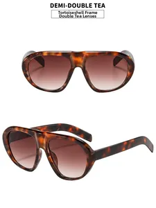 Detail of tortoise frame sunglasses with dual-tea gradient lenses and aviator double bridge