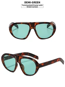 Detail view of tortoiseshell frame and green lenses on vintage oversized sunglasses