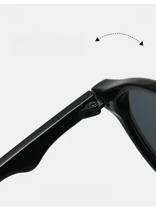 Detail of durable textured hinge on stylish round black sunglasses with metal screws