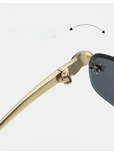 Macro shot of durable textured gold hinge on polygon sunglasses with dark lenses