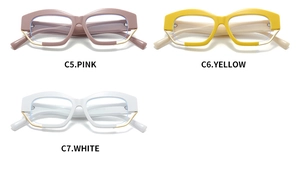 Close-up of irregular geometric eyewear frames in pink, yellow, and white colors