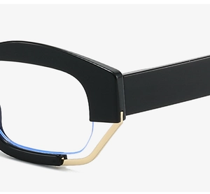Detailed close-up of thick black and gold hybrid frame glasses with blue light lenses