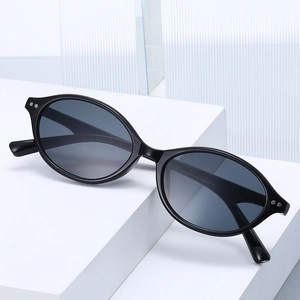 Retro black oval frame sunglasses with dark grey lenses and silver metal dot accents
