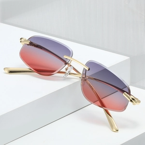 Polygonal rimless sunglasses with purple orange gradient lenses and gold metal frames