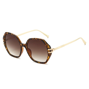 Lunettes de soleil hexagonales écaille de tortue avec branches dorées et verres dégradés