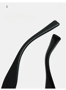 Detail of ergonomic curved mirror legs on glossy black polygonal sunglasses for comfort