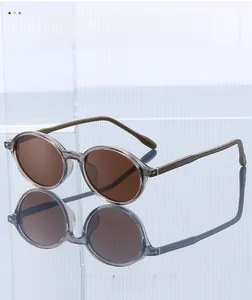 Detail of translucent gray TR90 sunglasses frame with dark brown lenses and fine legs