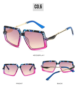 Detail view of square oversized sunglasses with leopard print and gradient lenses