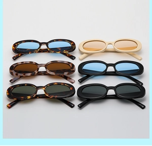 Flat lay display of retro oval sunglasses in six colors including tortoiseshell and black