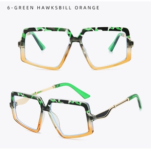 Détail d'une monture carrée avec dégradé écaille verte vers orange et branches dorées