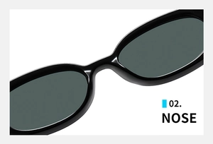 Detailed close-up of the comfortable nose bridge on black oval frame sunglasses