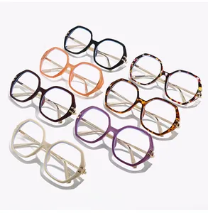 Detailed overhead view of seven stylish polygon eyeglass frames in various vibrant colors
