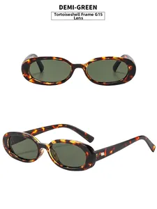 Detail of retro oval tortoiseshell sunglasses with dark green G15 lenses and metal accents