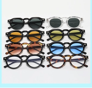 Matrix display of vintage round sunglasses with rivet accents and colorful lenses