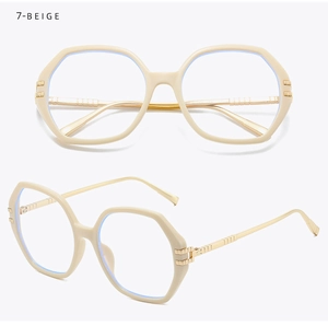 Detail view of beige polygonal glasses frame with textured golden metal temples