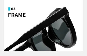 Detail of classic black sunglasses frame featuring the temple hinge and dark lens