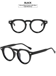 Detail of glossy black round frames with blue light blocking lenses and silver rivets