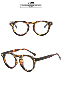 Detail view of tortoiseshell round frame glasses with metal rivets and blue light lens